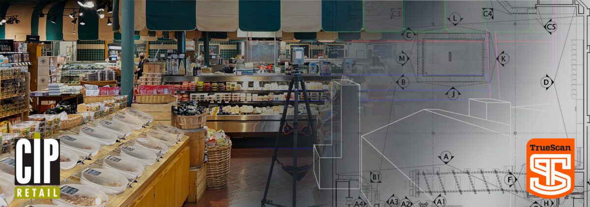 The inside of a freshmarket cheese and meat section with a laser scanning camera propped up in the middle of the aisle